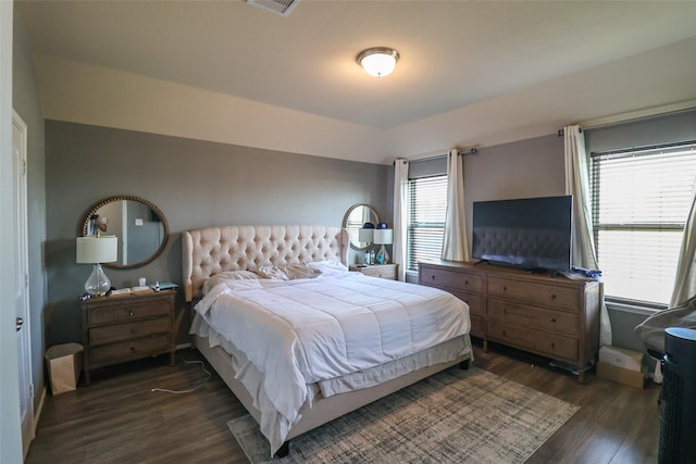 bedroom featuring dark wood finished floors