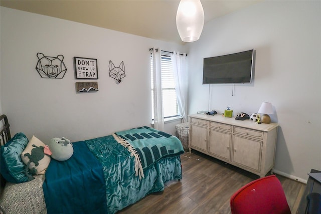 bedroom featuring dark wood-style floors