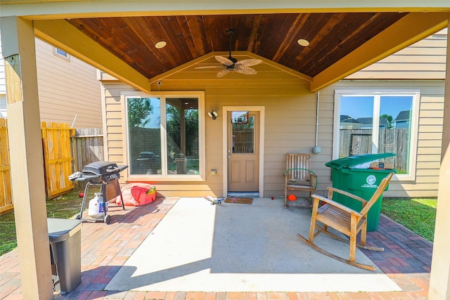 view of patio / terrace with fence, a ceiling fan, and area for grilling