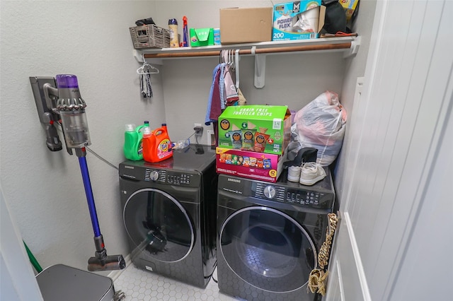 laundry area featuring washing machine and dryer and laundry area
