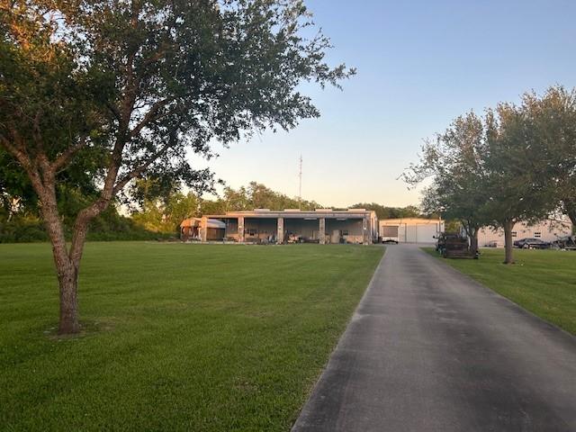ranch-style home featuring a garage and a front yard