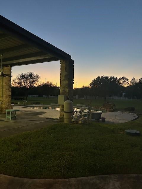 view of property's community with a yard