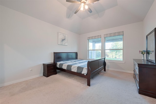 bedroom with light colored carpet, baseboards, a ceiling fan, and vaulted ceiling