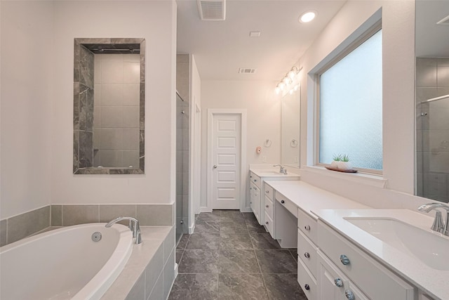 bathroom featuring double vanity, visible vents, a sink, and a stall shower