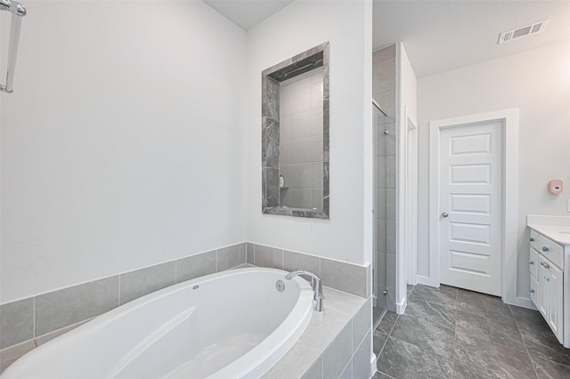 bathroom with a shower stall, vanity, visible vents, and a bath