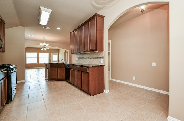 kitchen featuring black appliances, arched walkways, backsplash, a peninsula, and visible vents
