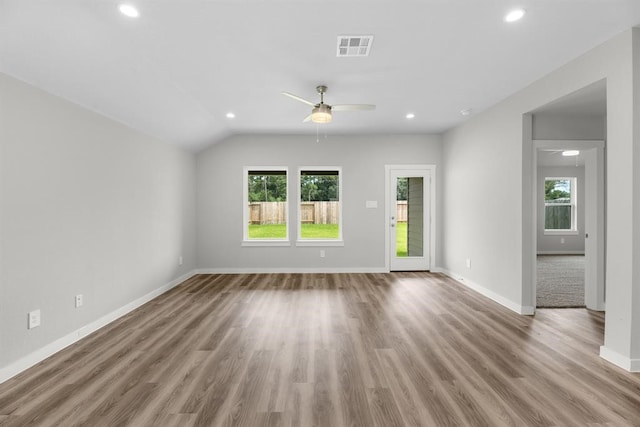 unfurnished living room featuring ceiling fan, recessed lighting, wood finished floors, and baseboards