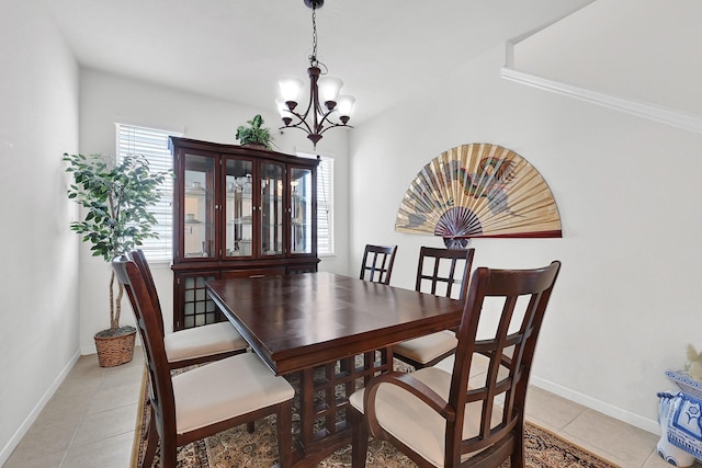 dining room featuring baseboards, an inviting chandelier, and light tile patterned flooring