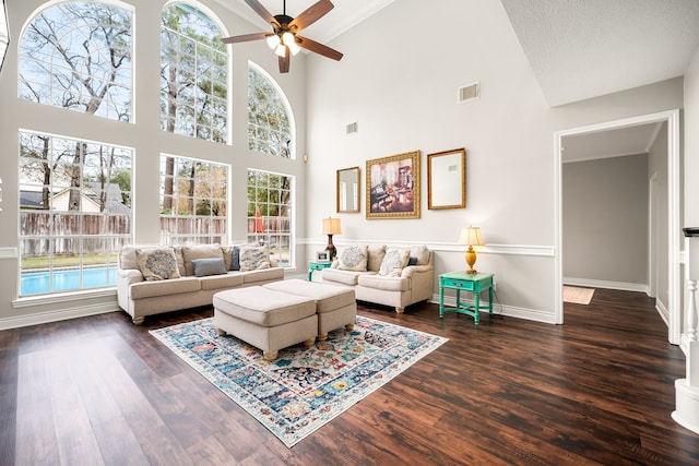 14102 Haynes Dr, Houston, TX 77069 - living area with ceiling fan, a towering ceiling, visible vents, baseboards, and dark wood-style floors