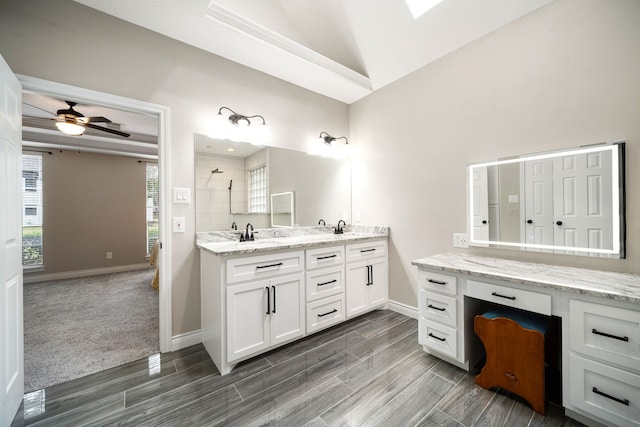 14102 Haynes Dr, Houston, TX 77069 - full bathroom featuring tiled shower, a ceiling fan, a sink, double vanity, and baseboards