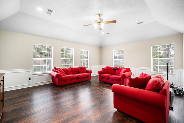 14102 Haynes Dr, Houston, TX 77069 - living room with visible vents, vaulted ceiling, and a wainscoted wall