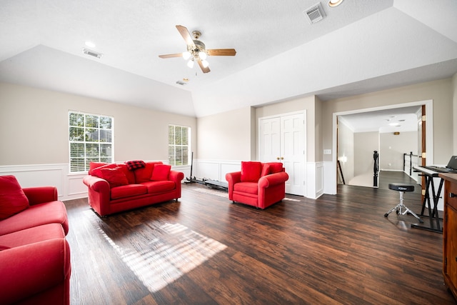 14102 Haynes Dr, Houston, TX 77069 - living room with wood finished floors, vaulted ceiling, visible vents, and a wainscoted wall