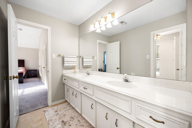 14102 Haynes Dr, Houston, TX 77069 - full bathroom with double vanity, visible vents, a sink, and connected bathroom