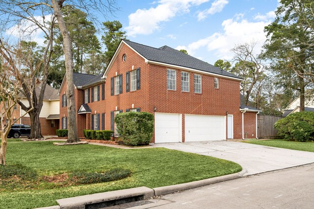 14102 Haynes Dr, Houston, TX 77069 - view of front facade with a garage, brick siding, a front lawn, and concrete driveway