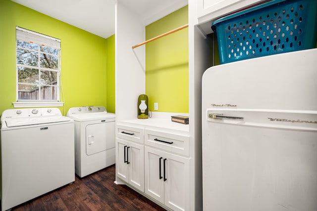 14102 Haynes Dr, Houston, TX 77069 - washroom featuring dark wood-style flooring, independent washer and dryer, and cabinet space