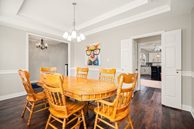 14102 Haynes Dr, Houston, TX 77069 - dining space with a chandelier, ornamental molding, a tray ceiling, and dark wood-style floors