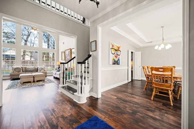 14102 Haynes Dr, Houston, TX 77069 - foyer featuring ornamental molding, stairway, a tray ceiling, and dark wood finished floors
