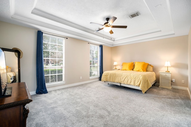 14102 Haynes Dr, Houston, TX 77069 - carpeted bedroom with a raised ceiling, baseboards, ornamental molding, and visible vents