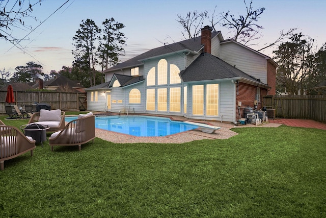 14102 Haynes Dr, Houston, TX 77069 - exterior space featuring a diving board, a yard, a fenced backyard, and a fenced in pool