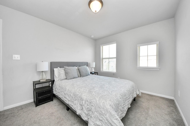 bedroom with carpet floors and baseboards