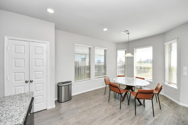 dining room with visible vents, baseboards, light wood-type flooring, and recessed lighting