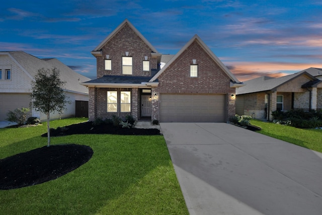 traditional-style home with concrete driveway, brick siding, an attached garage, and a front lawn