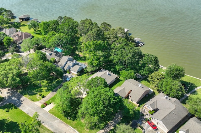 birds eye view of property with a water view and a residential view