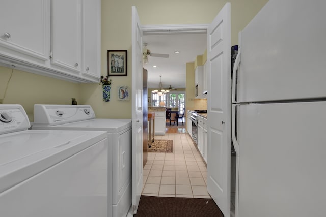 washroom featuring light tile patterned floors, independent washer and dryer, recessed lighting, ceiling fan with notable chandelier, and cabinet space