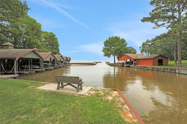 view of dock with a water view and a yard