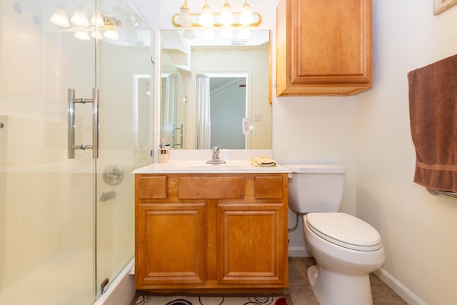 full bath featuring toilet, vanity, baseboards, and a shower with door