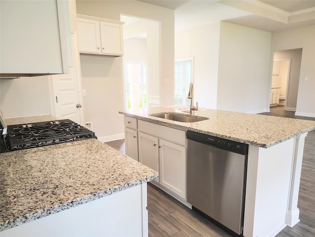 kitchen featuring stainless steel dishwasher, light stone countertops, light wood-type flooring, gas range, and a sink