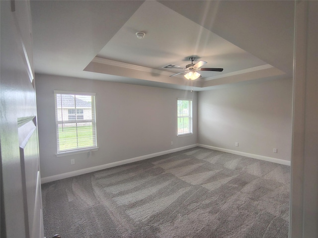 7 Greystone Ct, Angleton, TX 77515 - unfurnished room featuring a tray ceiling, carpet flooring, a ceiling fan, crown molding, and baseboards
