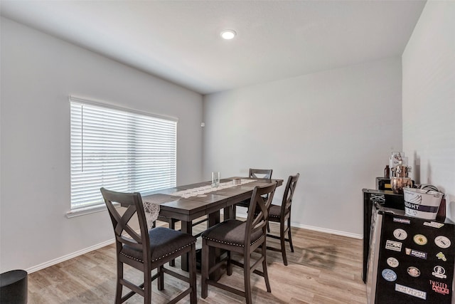 21723 Sarasota Spice St, Tomball, TX 77377 - dining room with recessed lighting, light wood-type flooring, and baseboards