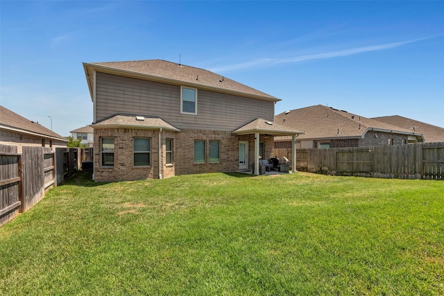 21723 Sarasota Spice St, Tomball, TX 77377 - rear view of property featuring a fenced backyard and a lawn