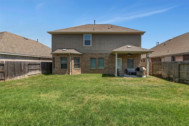 21723 Sarasota Spice St, Tomball, TX 77377 - back of house with a shingled roof, a yard, a fenced backyard, a patio, and brick siding