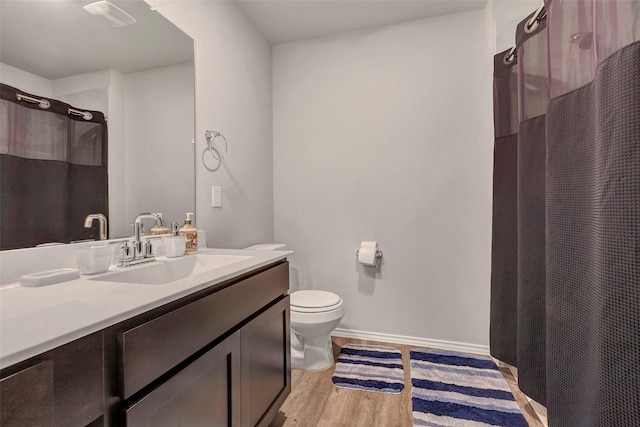 21723 Sarasota Spice St, Tomball, TX 77377 - full bath featuring vanity, visible vents, toilet, wood finished floors, and a shower with shower curtain