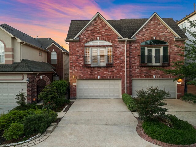 view of front of property with concrete driveway and brick siding