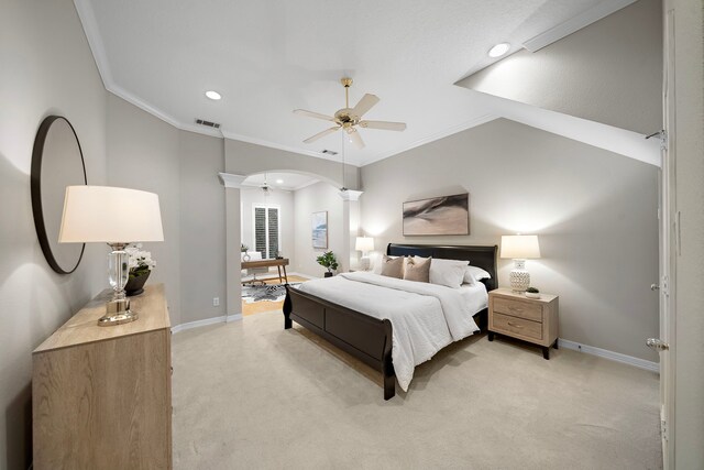 bedroom featuring ornate columns, arched walkways, light carpet, baseboards, and recessed lighting