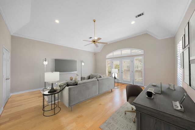 living room featuring lofted ceiling, a ceiling fan, visible vents, and crown molding