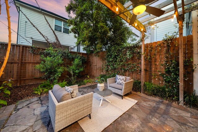 view of patio / terrace featuring a fenced backyard, a pergola, and an outdoor living space