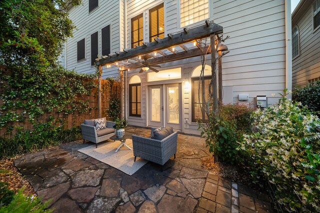 view of patio / terrace featuring an outdoor living space, a pergola, and fence