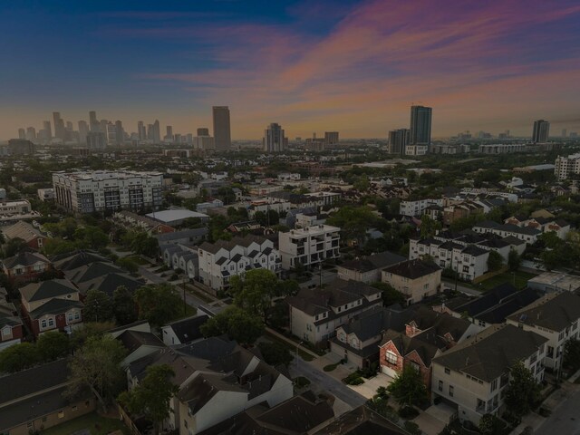 birds eye view of property with a city view