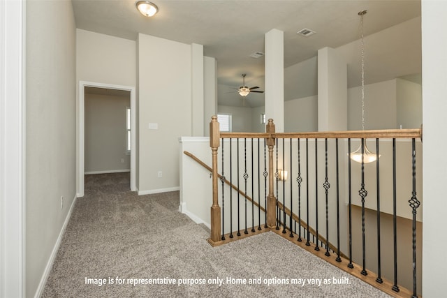 3718 Youpon Ln, Huntsville, TX 77340 - hall with visible vents, baseboards, an upstairs landing, and carpet flooring