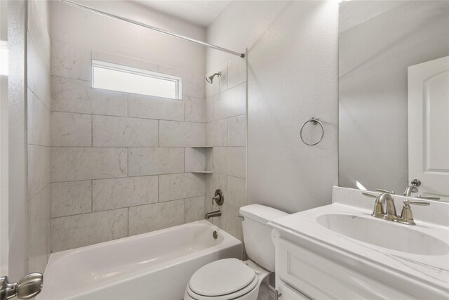full bath featuring toilet, bathtub / shower combination, and vanity