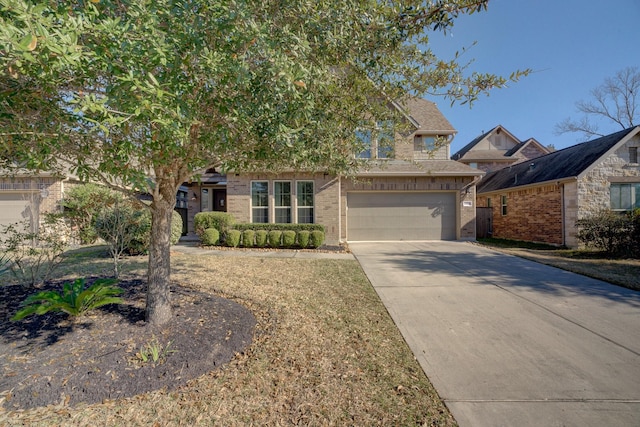 view of property hidden behind natural elements with brick siding, driveway, and an attached garage