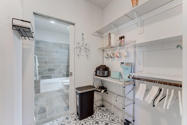 spacious closet featuring tile patterned floors