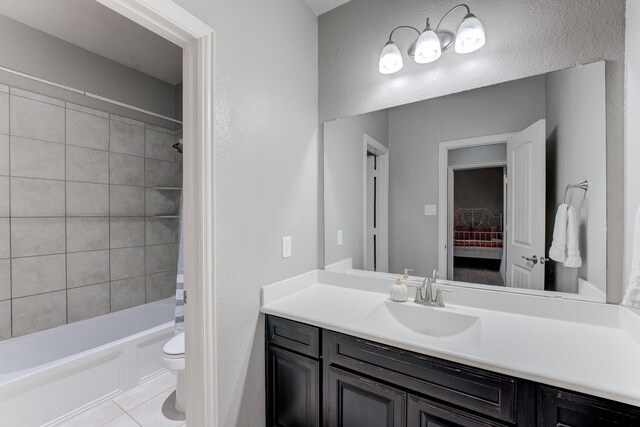 full bathroom featuring tile patterned floors, vanity, shower / tub combination, and toilet