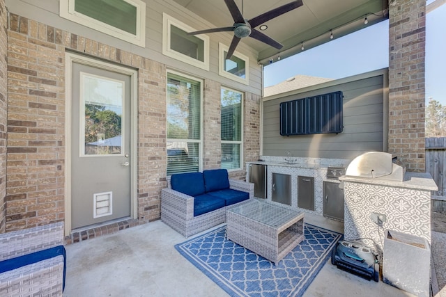 view of patio / terrace featuring outdoor lounge area, a sink, a ceiling fan, and area for grilling