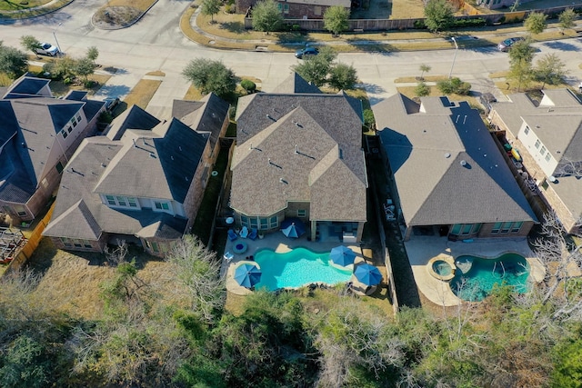 birds eye view of property with a residential view