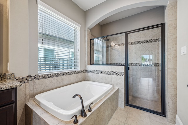 8227 Caroline Ridge Dr, Humble, TX 77396 - full bath with a shower stall, a bath, vanity, and tile patterned floors